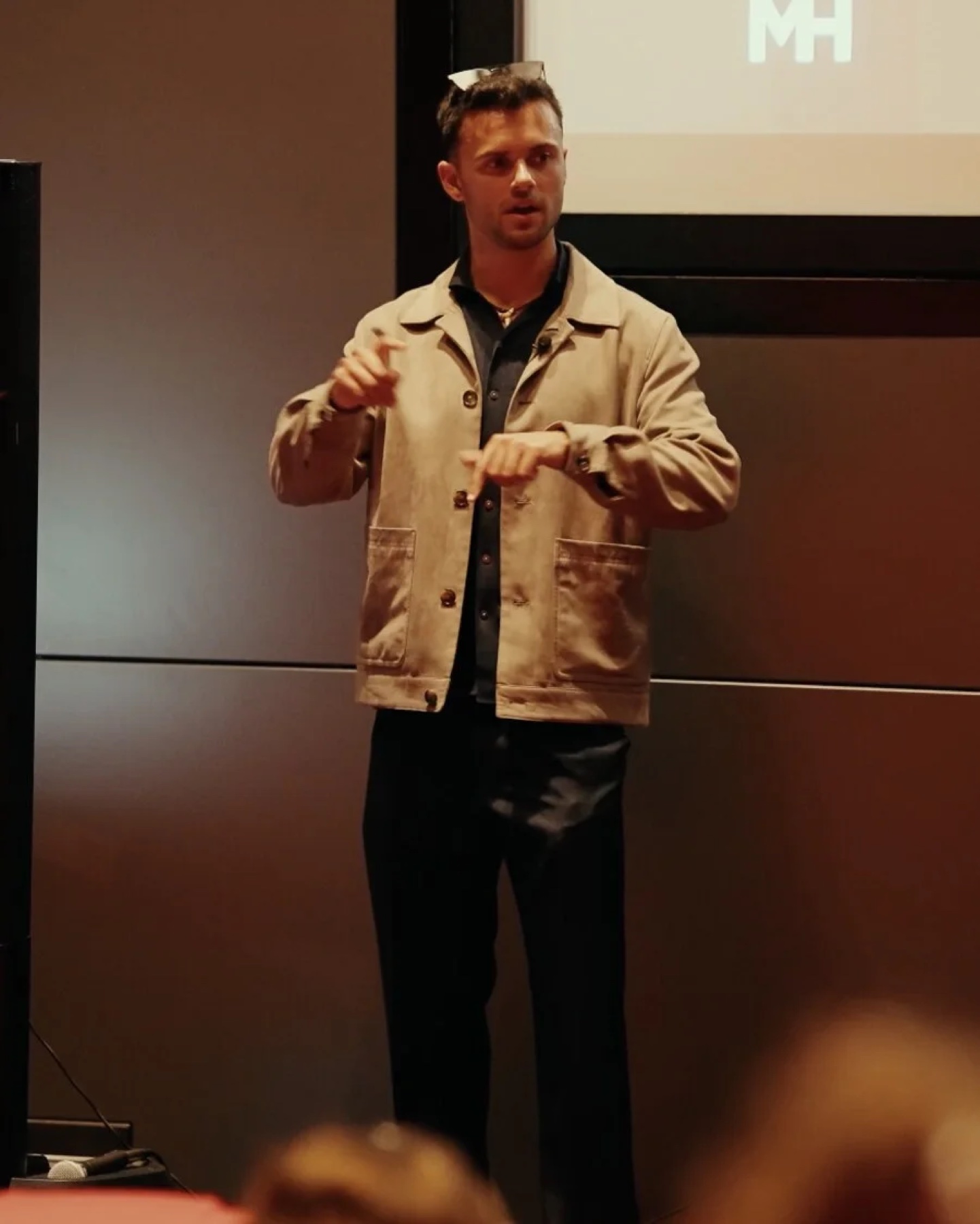Ethan Monkhouse mid-explanation on stage